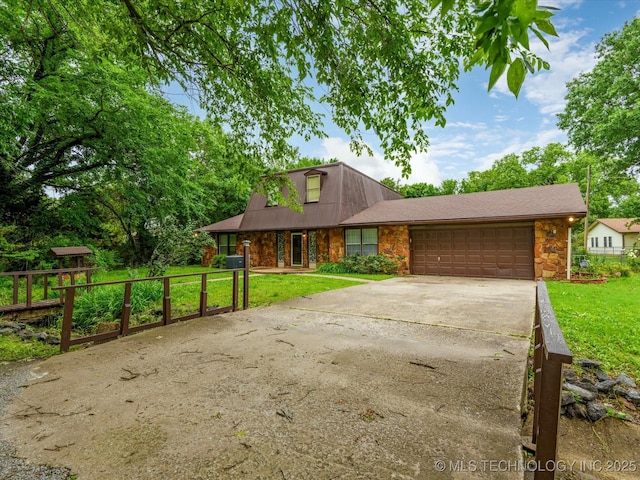 512 W 20th, Bartlesville, OK 74003 - view of front of property featuring stone siding, an attached garage, and driveway
