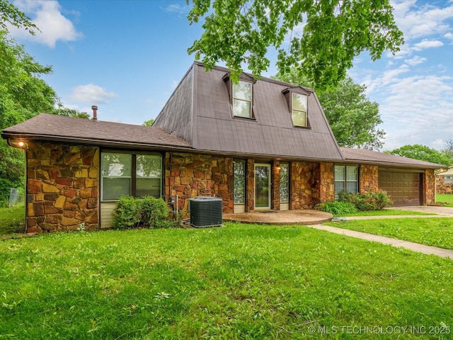512 W 20th, Bartlesville, OK 74003 - view of front facade featuring stone siding, central air condition unit, an attached garage, and a front yard