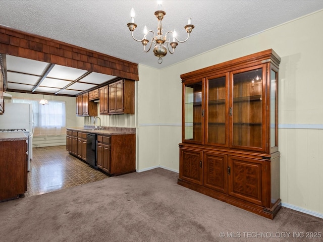 512 W 20th, Bartlesville, OK 74003 - kitchen with black dishwasher, a chandelier, carpet, wainscoting, and a textured ceiling