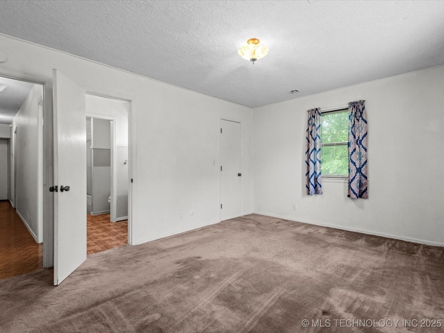 512 W 20th, Bartlesville, OK 74003 - carpeted empty room with a textured ceiling