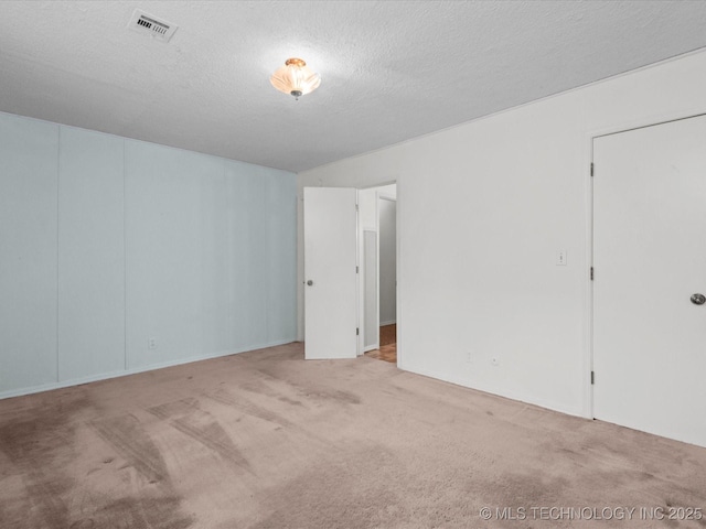 512 W 20th, Bartlesville, OK 74003 - carpeted empty room featuring a textured ceiling