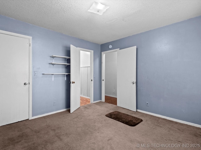 512 W 20th, Bartlesville, OK 74003 - unfurnished bedroom with carpet flooring, a textured ceiling, baseboards, and a closet
