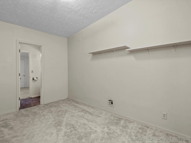 512 W 20th, Bartlesville, OK 74003 - empty room featuring carpet floors and a textured ceiling