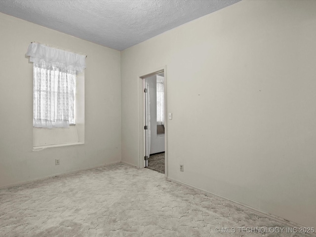 512 W 20th, Bartlesville, OK 74003 - carpeted empty room with a textured ceiling