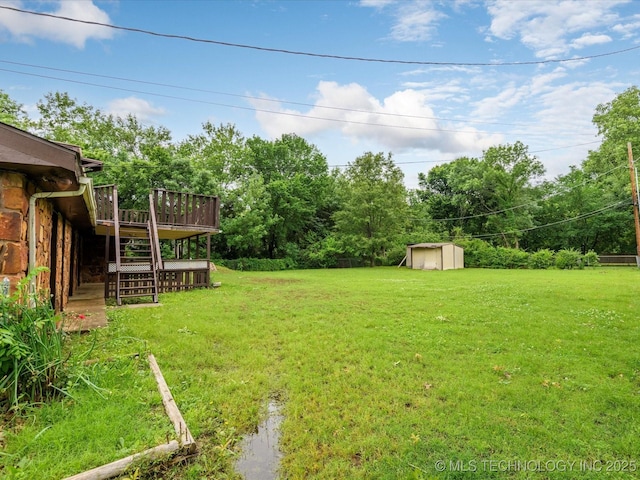512 W 20th, Bartlesville, OK 74003 - view of green lawn with stairs and a wooden deck