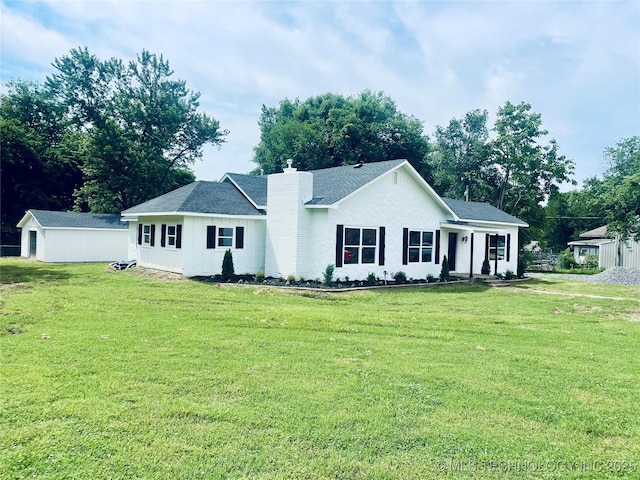 305 E Hickory Ave, Fort Gibson, OK 74434 - ranch-style house with a front lawn and a chimney