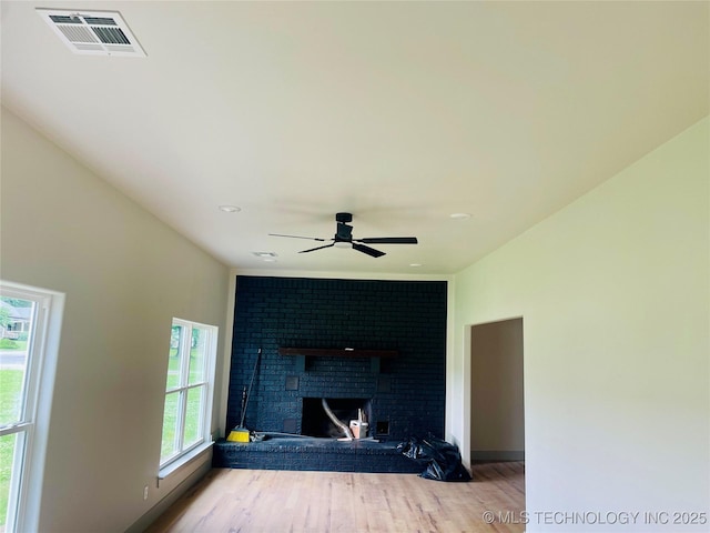 305 E Hickory Ave, Fort Gibson, OK 74434 - detailed view of a fireplace, wood finished floors, ceiling fan, and recessed lighting