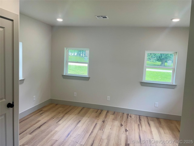 305 E Hickory Ave, Fort Gibson, OK 74434 - empty room featuring healthy amount of natural light, wood finished floors, baseboards, and recessed lighting