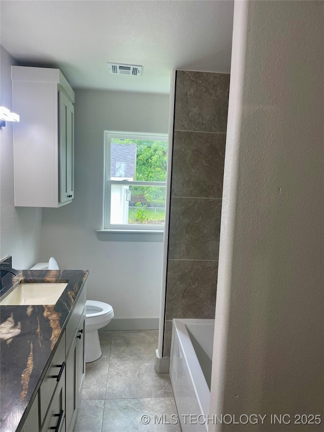 305 E Hickory Ave, Fort Gibson, OK 74434 - full bath with toilet, vanity, a bathtub, and baseboards