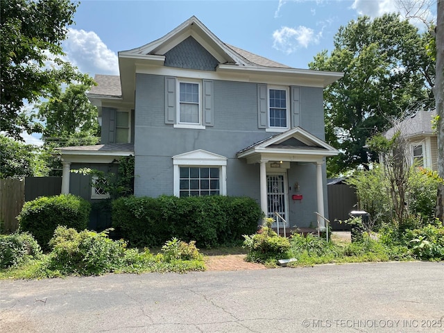 1501 E Okmulgee St, Muskogee, OK 74403 - view of front facade with brick siding and roof with shingles
