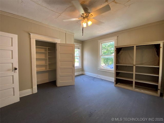 1501 E Okmulgee St, Muskogee, OK 74403 - unfurnished bedroom featuring crown molding, baseboards, a closet, and a ceiling fan