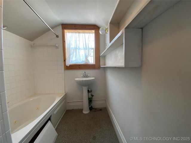 1501 E Okmulgee St, Muskogee, OK 74403 - full bath with vaulted ceiling, a combined bath / shower with jetted tub, baseboards, and a sink