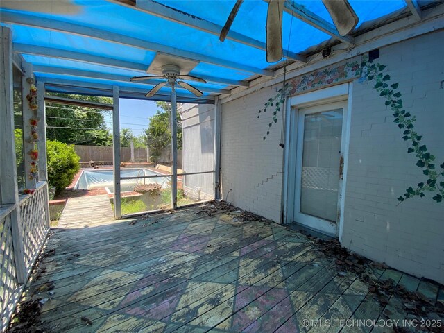 1501 E Okmulgee St, Muskogee, OK 74403 - unfurnished sunroom featuring ceiling fan