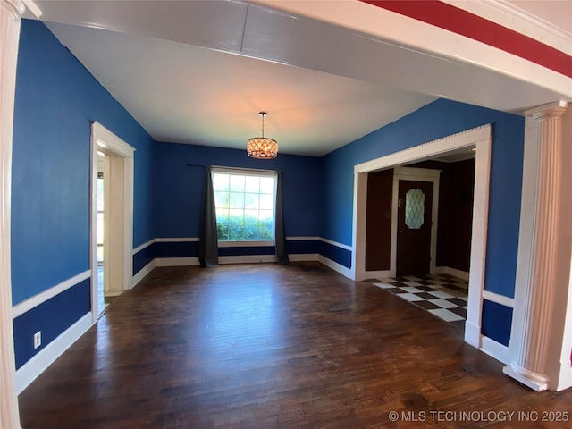 1501 E Okmulgee St, Muskogee, OK 74403 - unfurnished room with wood finished floors, a chandelier, baseboards, and decorative columns