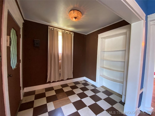1501 E Okmulgee St, Muskogee, OK 74403 - spare room featuring tile patterned floors, baseboards, and built in shelves