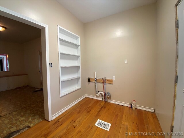 1501 E Okmulgee St, Muskogee, OK 74403 - washroom featuring light wood-style flooring and baseboards