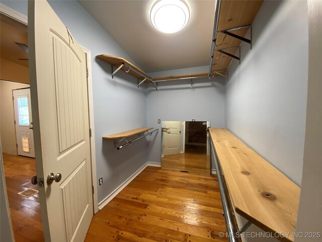 1501 E Okmulgee St, Muskogee, OK 74403 - walk in closet with hardwood / wood-style flooring