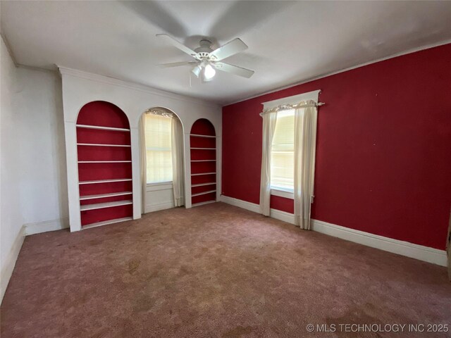 1501 E Okmulgee St, Muskogee, OK 74403 - empty room with ceiling fan, built in shelves, carpet floors, crown molding, and baseboards
