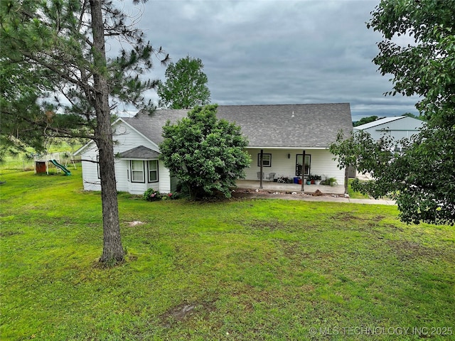 5401 N 435th Rd, Adair, OK 74330 - back of house with a playground, a lawn, and roof with shingles