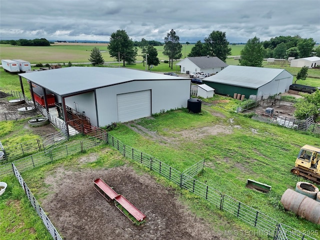 5401 N 435th Rd, Adair, OK 74330 - view of yard with an outdoor structure, an exterior structure, a rural view, driveway, and a garage