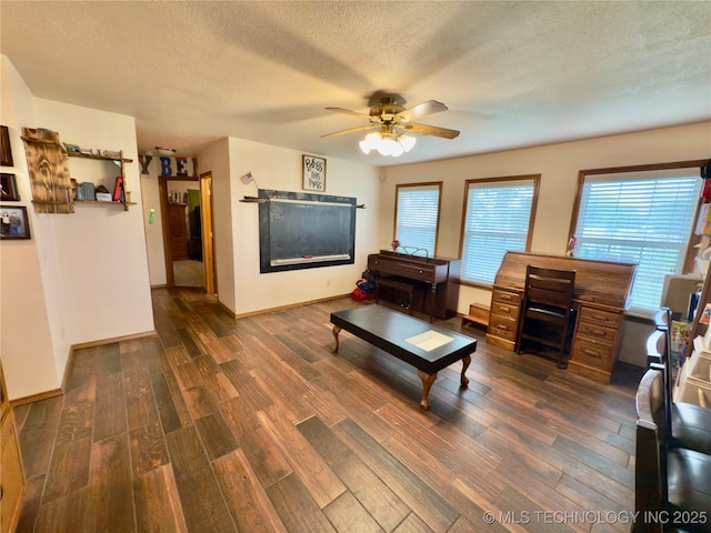 5401 N 435th Rd, Adair, OK 74330 - living room featuring ceiling fan, wood finished floors, a textured ceiling, and baseboards