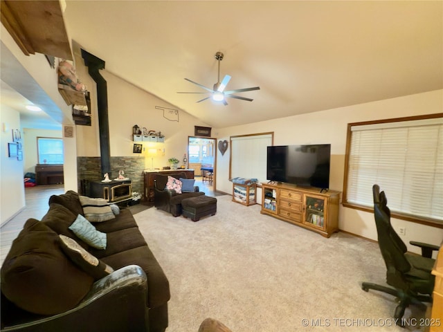 5401 N 435th Rd, Adair, OK 74330 - carpeted living room with a wood stove, a ceiling fan, and lofted ceiling