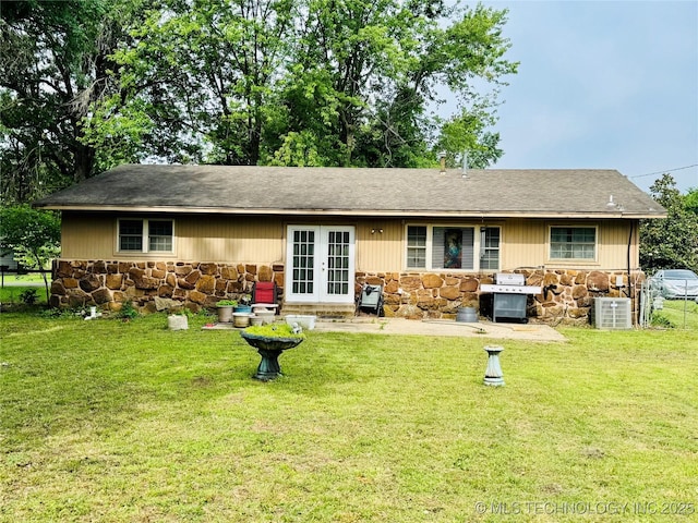 14009 S 295th E Ave, Coweta, OK 74429 - back of property with stone siding, french doors, and a yard