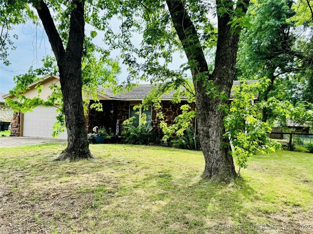 14009 S 295th E Ave, Coweta, OK 74429 - view of front of house featuring stone siding, a garage, and driveway