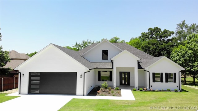 1223 Buckingham, Ardmore, OK 73401 - modern farmhouse featuring an attached garage, concrete driveway, roof with shingles, and stucco siding