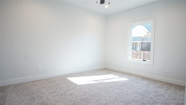 1223 Buckingham, Ardmore, OK 73401 - empty room with light colored carpet, baseboards, and ceiling fan