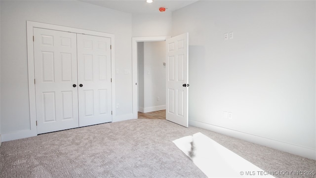 1223 Buckingham, Ardmore, OK 73401 - unfurnished bedroom with carpet flooring, a closet, and baseboards
