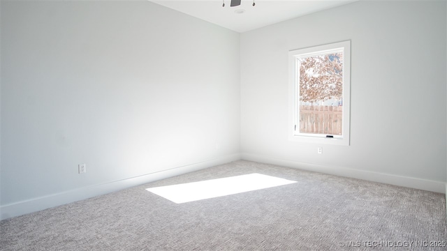 1223 Buckingham, Ardmore, OK 73401 - carpeted spare room featuring baseboards and a ceiling fan
