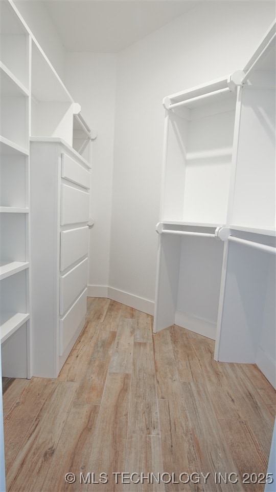 1223 Buckingham, Ardmore, OK 73401 - walk in closet with wood finished floors