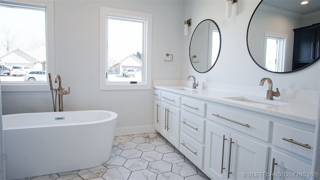 1223 Buckingham, Ardmore, OK 73401 - full bathroom with double vanity, crown molding, a soaking tub, baseboards, and tile patterned floors