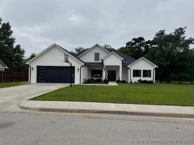 1223 Buckingham, Ardmore, OK 73401 - view of front of home with a garage and concrete driveway