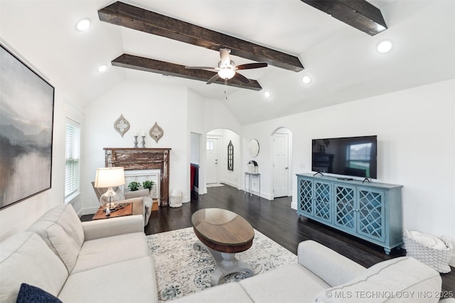 2621 S Catalayah Ln, Claremore, OK 74019 - living area featuring arched walkways, ceiling fan, dark wood-style flooring, beamed ceiling, and baseboards
