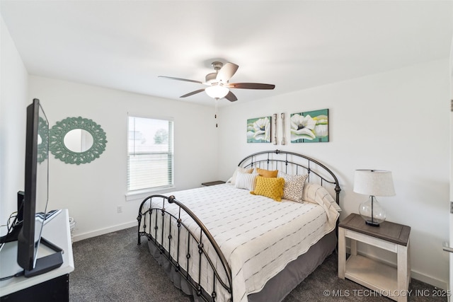 2621 S Catalayah Ln, Claremore, OK 74019 - bedroom featuring baseboards, dark carpet, and a ceiling fan