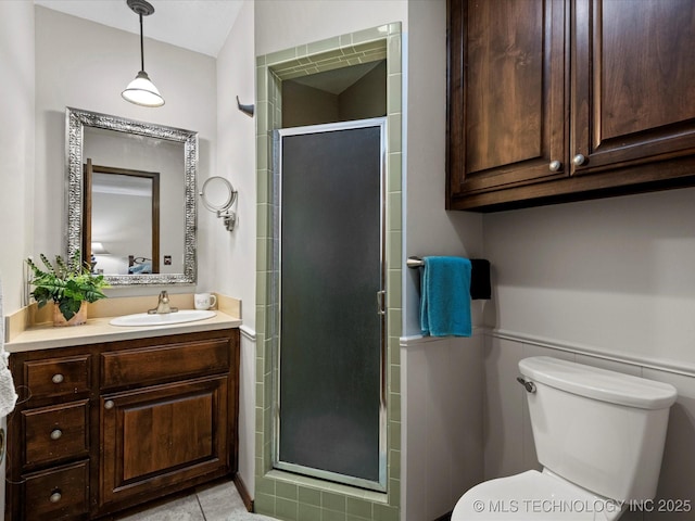1800 SE Polaris Dr, Bartlesville, OK 74006 - full bath with vanity, a shower stall, and a wainscoted wall