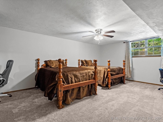 1800 SE Polaris Dr, Bartlesville, OK 74006 - carpeted bedroom with a textured ceiling and a ceiling fan