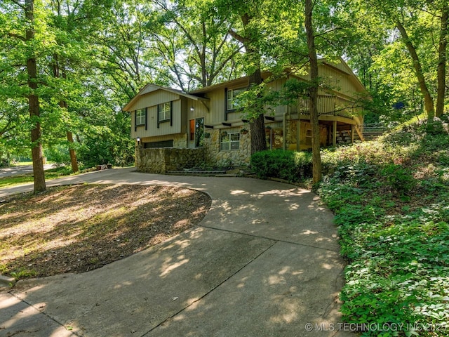 1800 SE Polaris Dr, Bartlesville, OK 74006 - bi-level home with stone siding and concrete driveway
