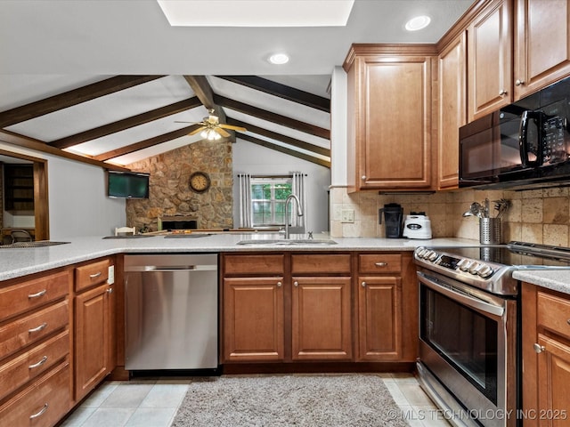 1800 SE Polaris Dr, Bartlesville, OK 74006 - kitchen with appliances with stainless steel finishes, tasteful backsplash, ceiling fan, light tile patterned flooring, and brown cabinets