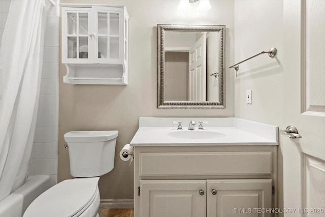 9926 S 79th E Ave, Tulsa, OK 74133 - bathroom with vanity, toilet, shower / bath combo with shower curtain, and baseboards