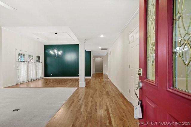 9926 S 79th E Ave, Tulsa, OK 74133 - entryway featuring arched walkways, a chandelier, wood finished floors, ornamental molding, and baseboards