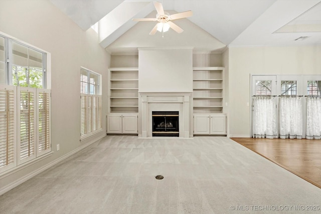 9926 S 79th E Ave, Tulsa, OK 74133 - unfurnished living room with carpet flooring, lofted ceiling, ceiling fan, baseboards, and a fireplace