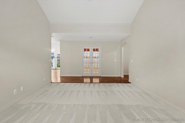 9926 S 79th E Ave, Tulsa, OK 74133 - unfurnished room with carpet floors, baseboards, ornamental molding, and french doors