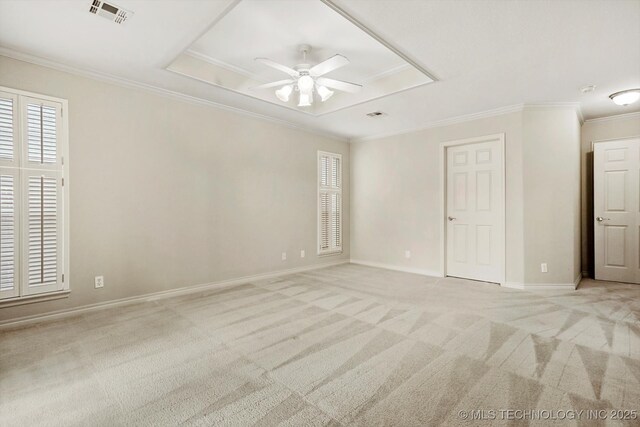 9926 S 79th E Ave, Tulsa, OK 74133 - spare room featuring light colored carpet, ceiling fan, plenty of natural light, ornamental molding, and baseboards