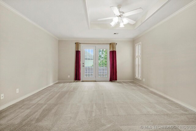 9926 S 79th E Ave, Tulsa, OK 74133 - spare room with ornamental molding, carpet, a tray ceiling, a ceiling fan, and baseboards