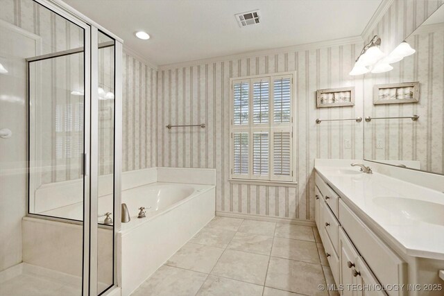 9926 S 79th E Ave, Tulsa, OK 74133 - bathroom with wallpapered walls, a bath, a shower stall, double vanity, and baseboards