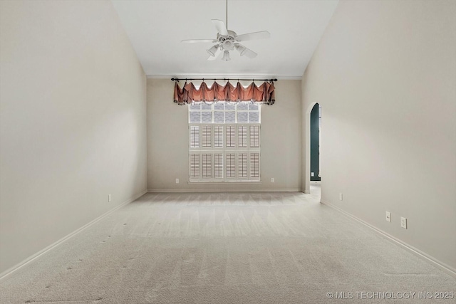 9926 S 79th E Ave, Tulsa, OK 74133 - carpeted spare room featuring a ceiling fan, arched walkways, baseboards, and lofted ceiling
