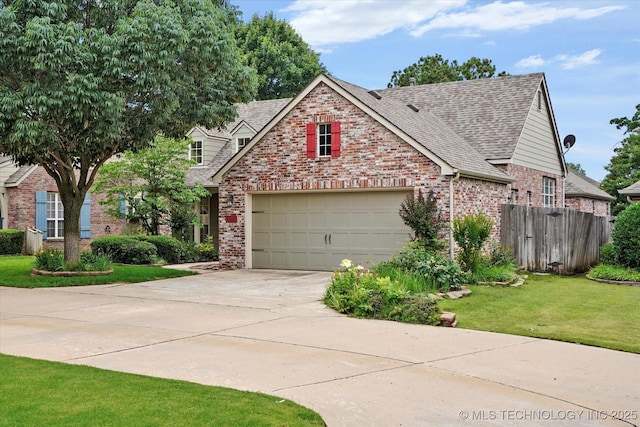 9926 S 79th E Ave, Tulsa, OK 74133 - view of front facade with brick siding, concrete driveway, and roof with shingles